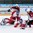 ZUG, SWITZERLAND - APRIL 17: Latvia's Filips Buncis #14 with a scoring chance against Daniel Vladar #30 of the Czech Republic while Filip Suchy #24 defends and Petr Kalina #5 and Kristaps Zile #7 look on during preliminary round action at the 2015 IIHF Ice Hockey U18 World Championship. (Photo by Francois Laplante/HHOF-IIHF Images)
